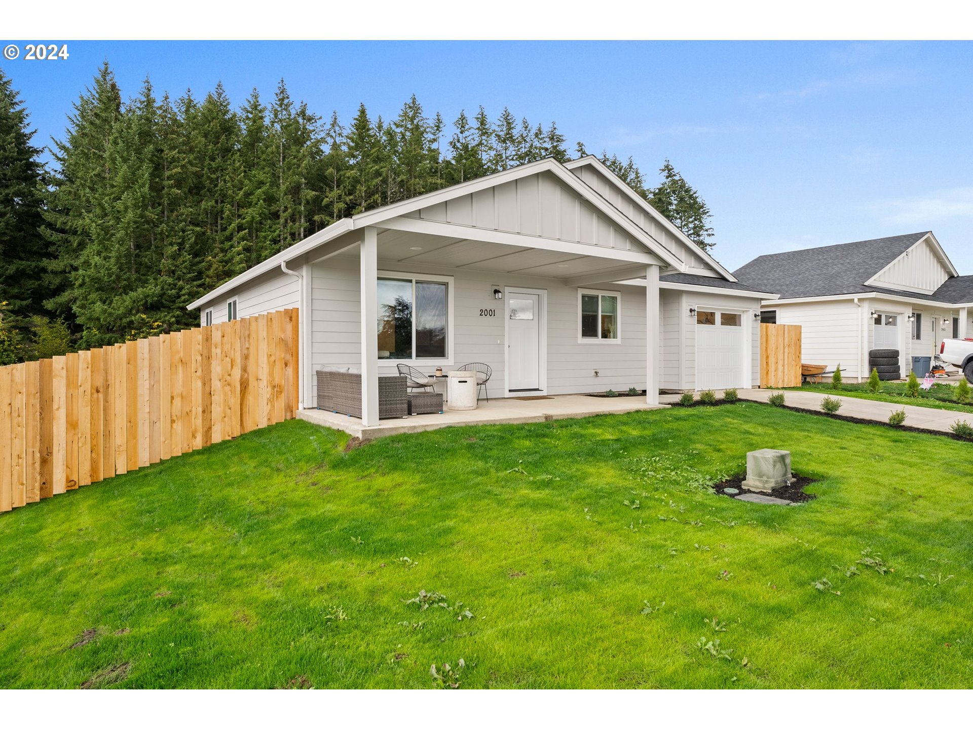 2001 Apple Road Winlock, WA 98596 - Photo 2 of 24 a front view of a house with a yard and trees