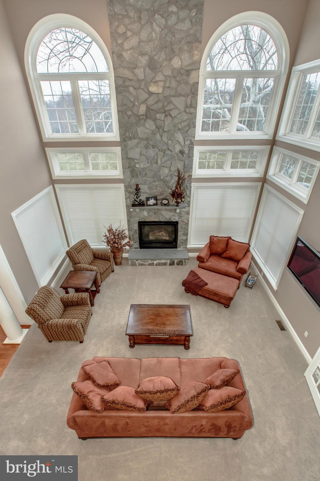 1152 Markell Court Reston, VA 20194 - Photo 12 of 30 a living room with furniture a large window and a fireplace