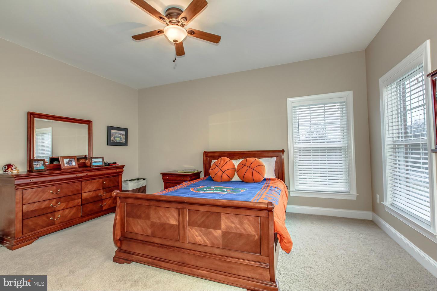 1152 Markell Court Reston, VA 20194 - Photo 18 of 30 a bedroom with a bed and a chandelier