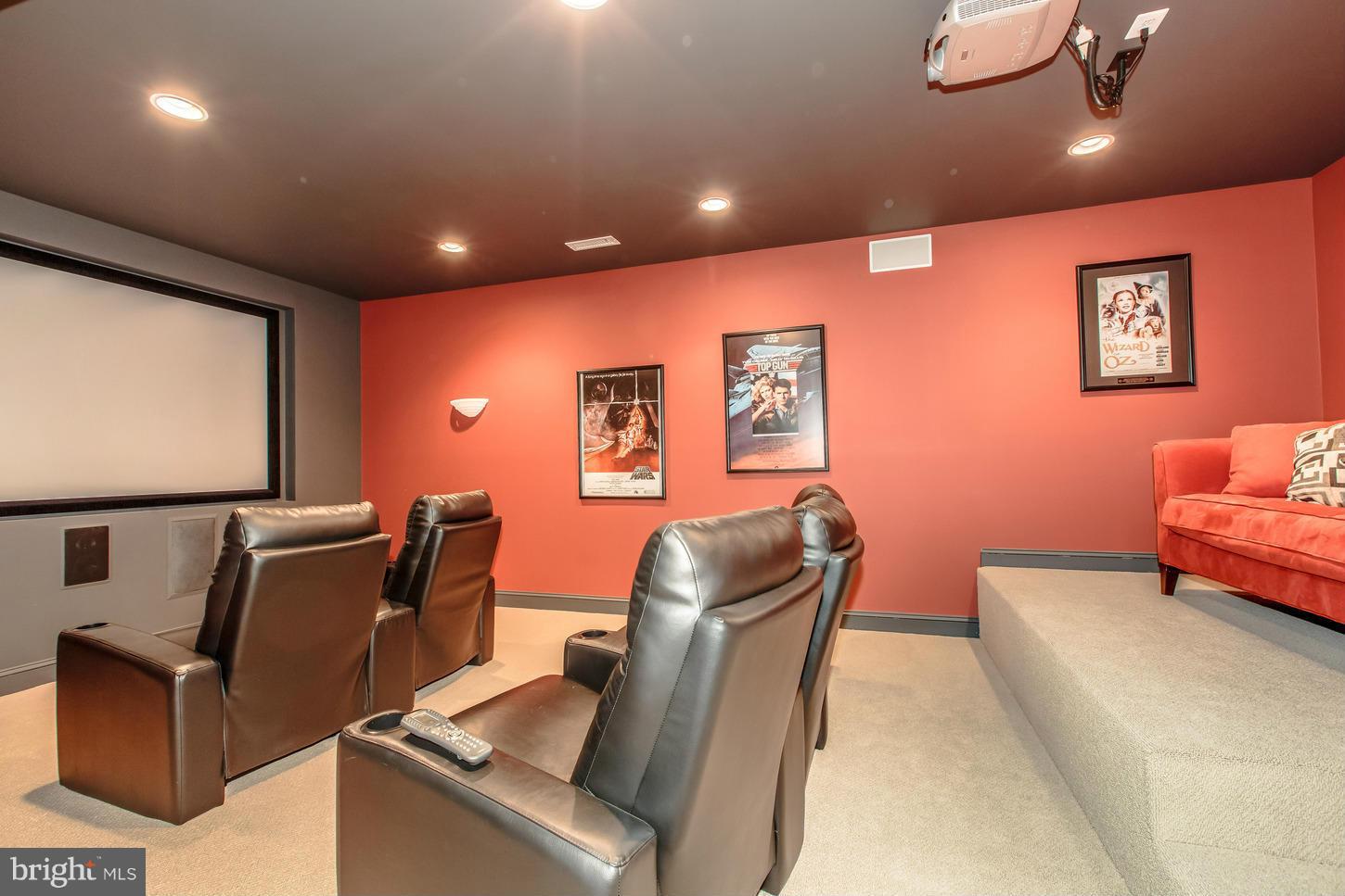 1152 Markell Court Reston, VA 20194 - Photo 25 of 30 a blue room with furniture and a projector screen