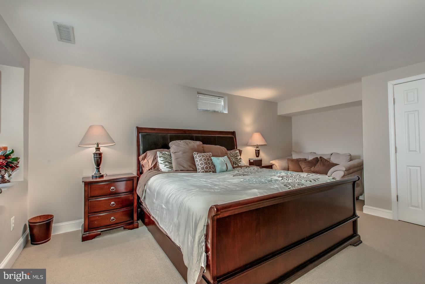 1152 Markell Court Reston, VA 20194 - Photo 27 of 30 a bedroom with a bed and a dresser in it