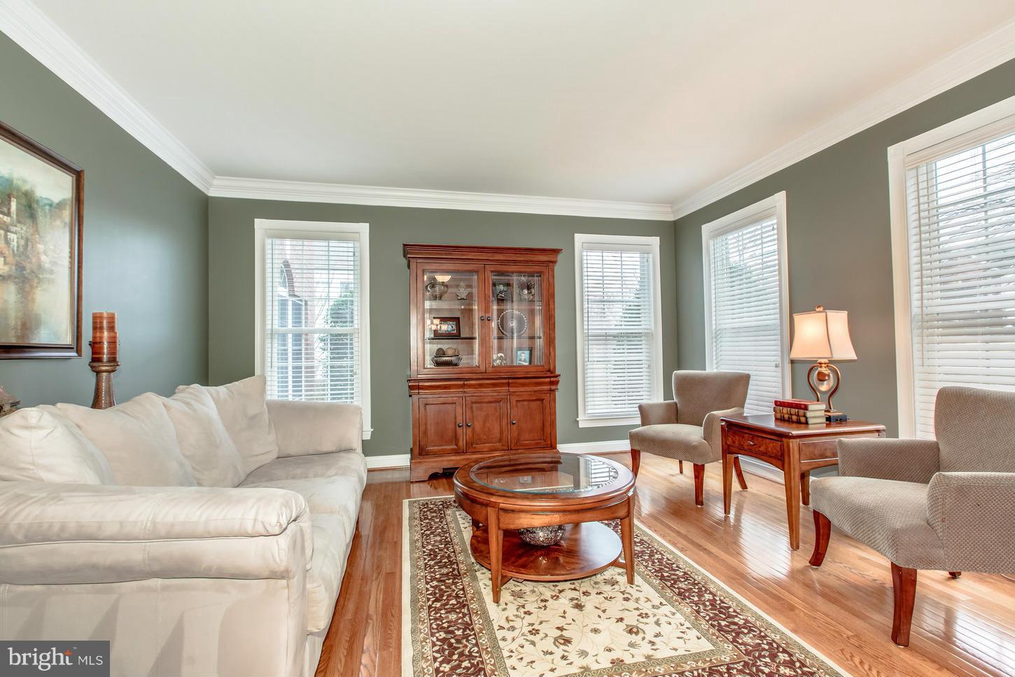 1152 Markell Court Reston, VA 20194 - Photo 4 of 30 a living room with furniture wooden floor and a large window