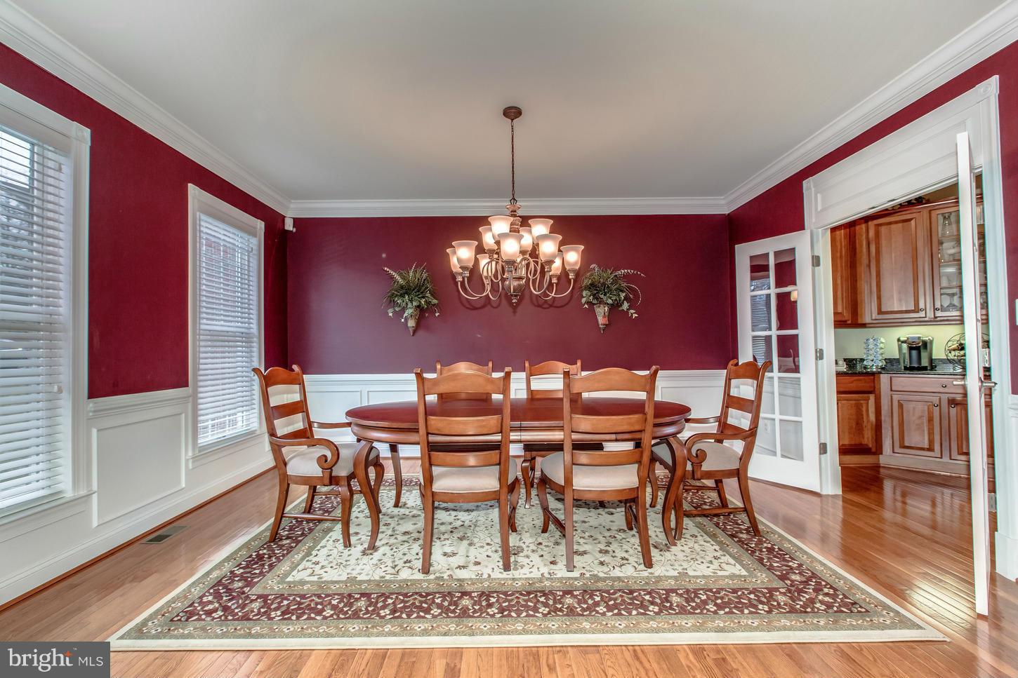 1152 Markell Court Reston, VA 20194 - Photo 5 of 30 a dining room with furniture a rug and wooden floor