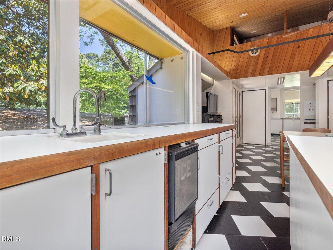 215 Hillcrest Road Raleigh, NC 27605 - Photo 49 of 97 a kitchen with a stove and a sink