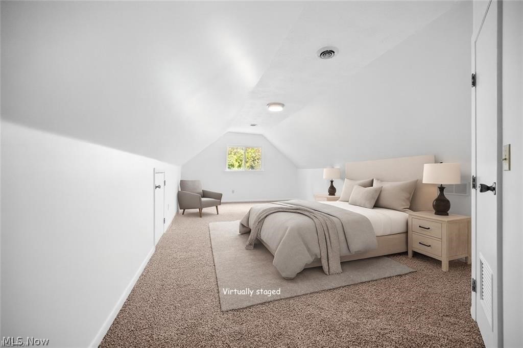 28300 Aurora Road Solon, OH 44139 - Photo 20 of 36 Spacious room with sloped ceilings and light brown carpeted flooring