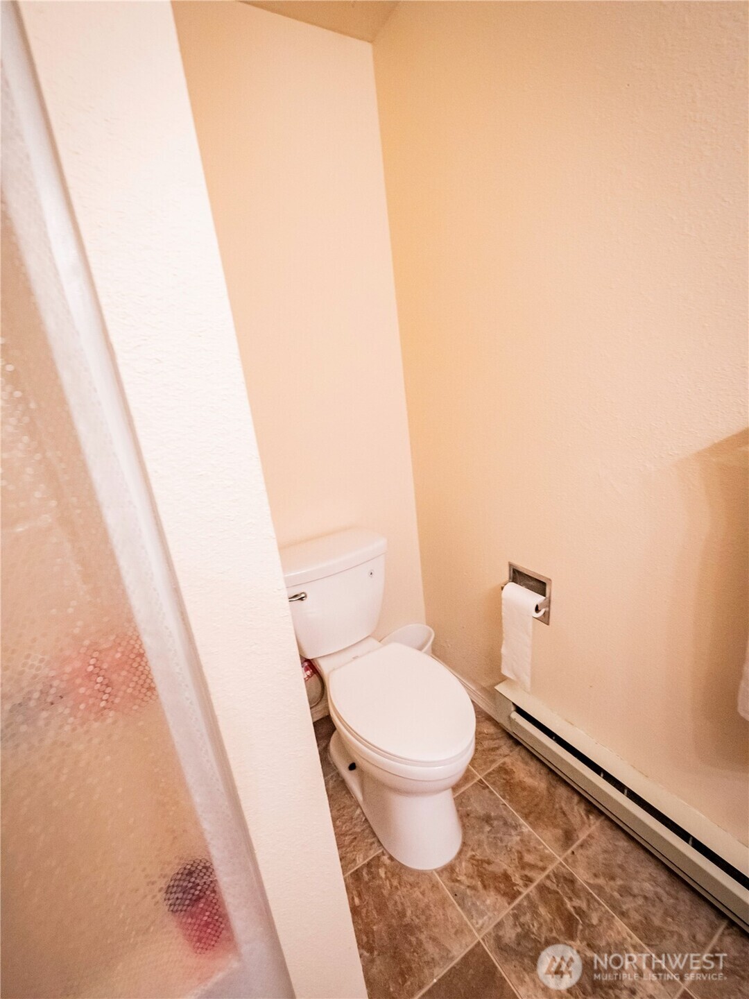 414 Ontario Street Hoquiam, WA 98550 - Photo 15 of 40 a white toilet sitting next to a shower