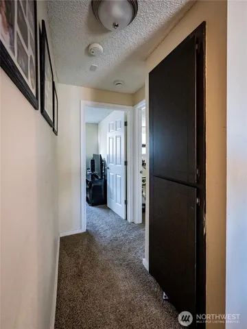 a bedroom with a bed couch and a window