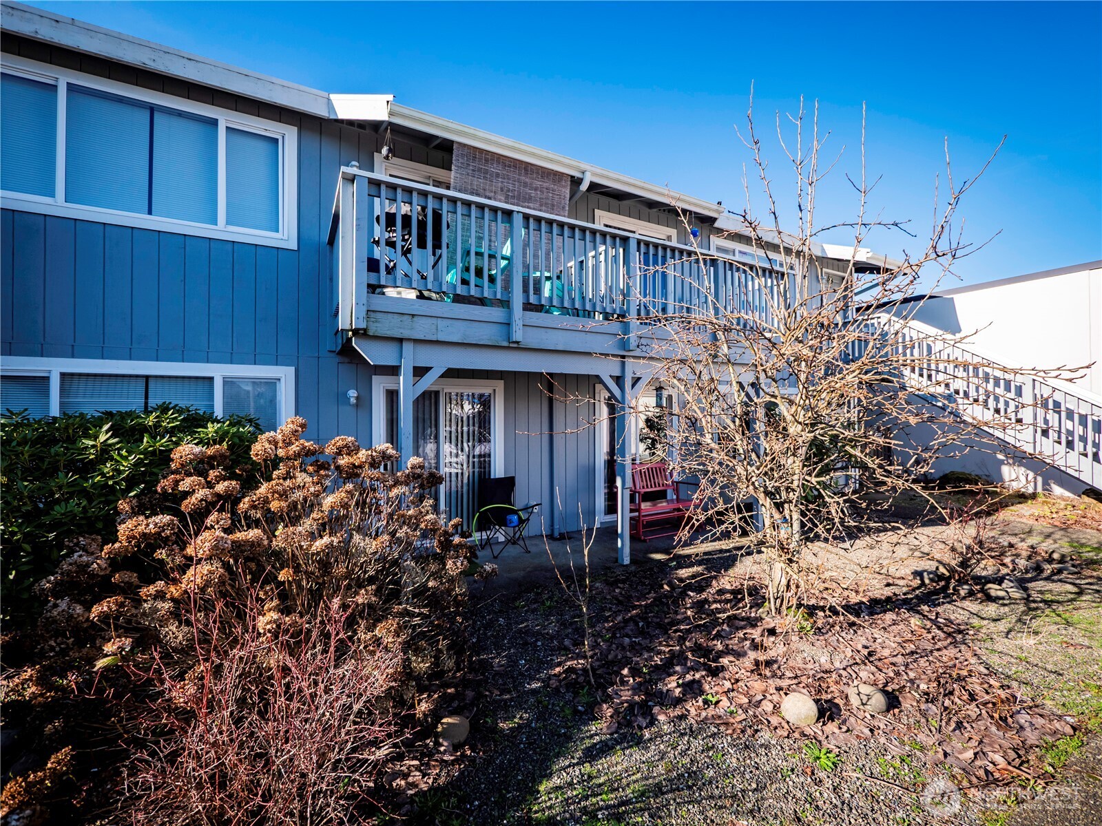 414 Ontario Street Hoquiam, WA 98550 - Photo 8 of 40 a view of a house with a small yard and wooden fence