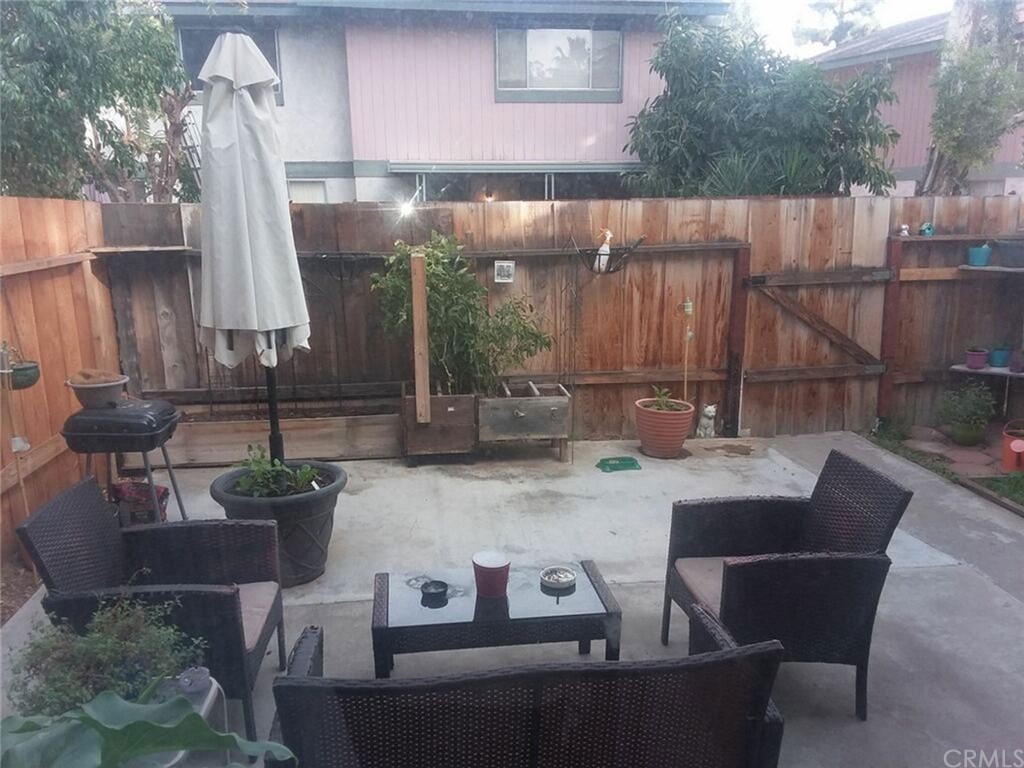4823 Jackson Street, Unit C Riverside, CA 92503 - Photo 1 of 1 a view of table and chair in patio
