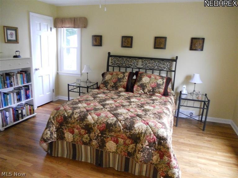 1910 Temblethurst Road South Euclid, OH 44121 - Photo 7 of 13 First Floor Master Bedroom with Gleaming Hardwood Floors