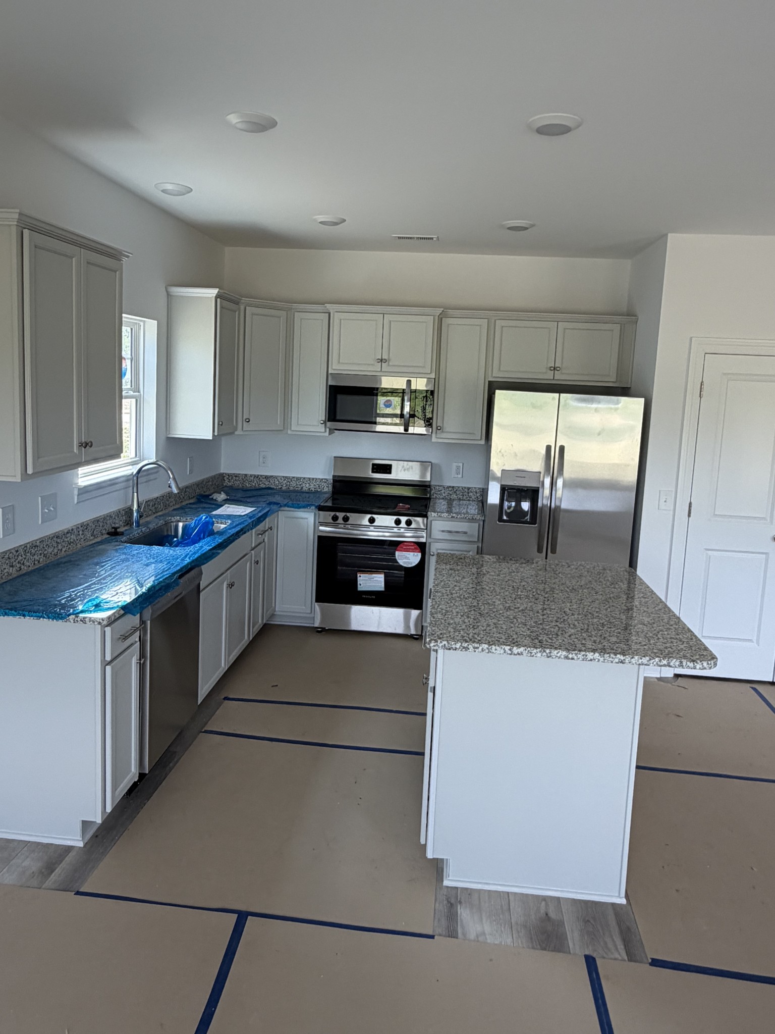 1209 Euclid Murfreesboro, TN 37127 - Photo 4 of 14 a kitchen with granite countertop a sink a stove and a refrigerator