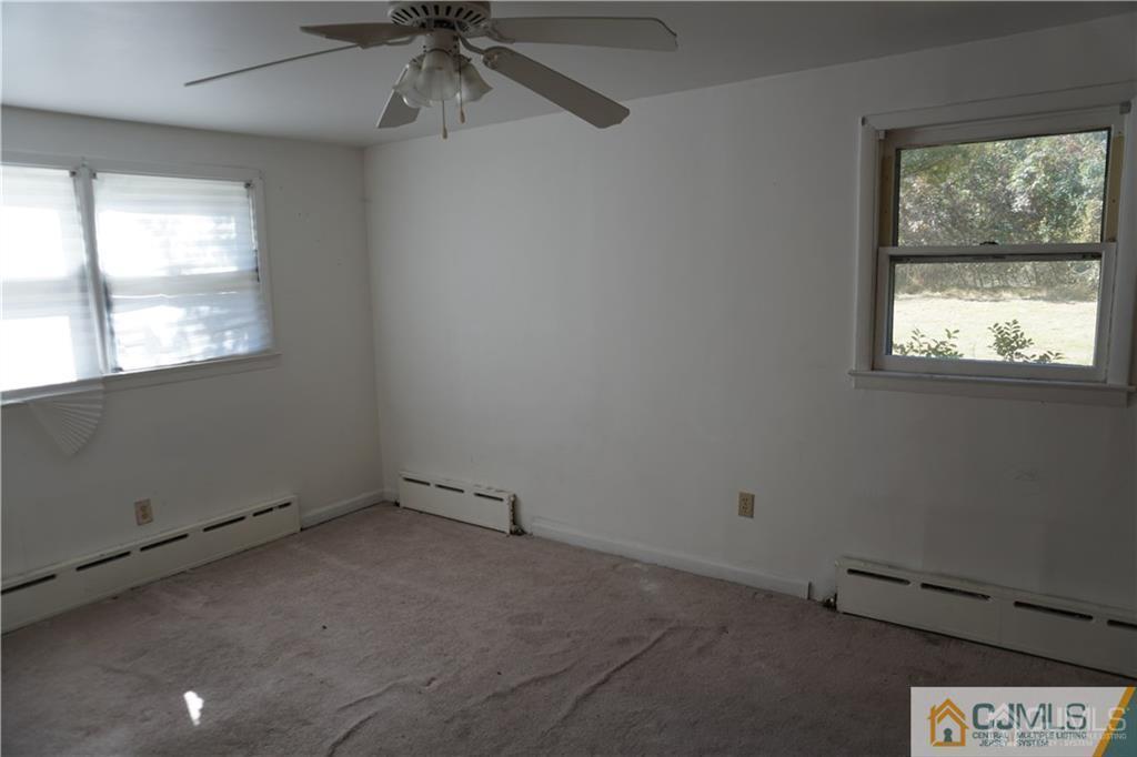 634 Old Stage Road East Brunswick, NJ 08816 - Photo 6 of 17 an empty room with a window