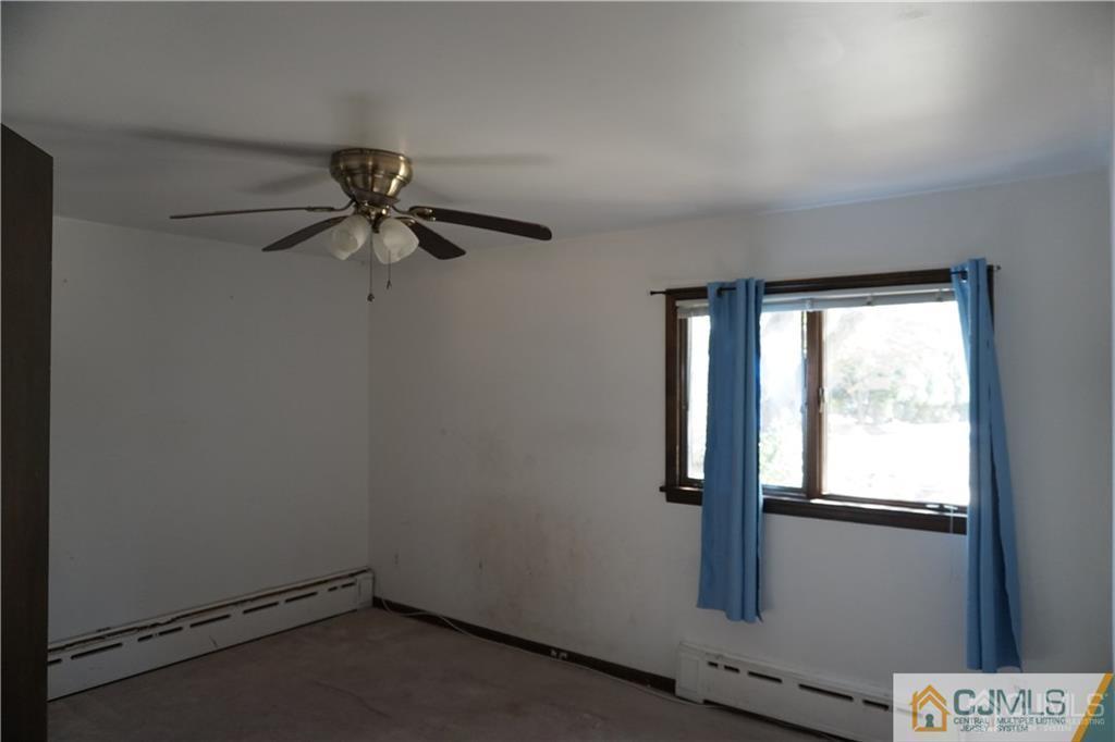 634 Old Stage Road East Brunswick, NJ 08816 - Photo 10 of 17 an empty room with a window