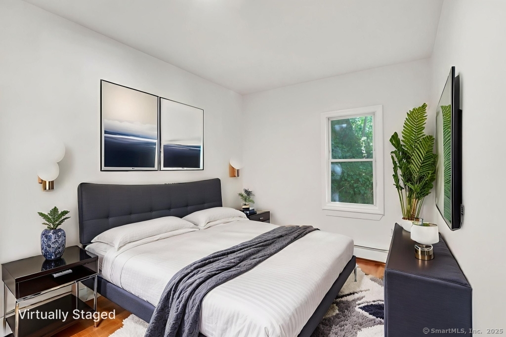 100 Mt Pleasant Street Derby, CT 06418 - Photo 16 of 40 a bedroom with a bed and a large window