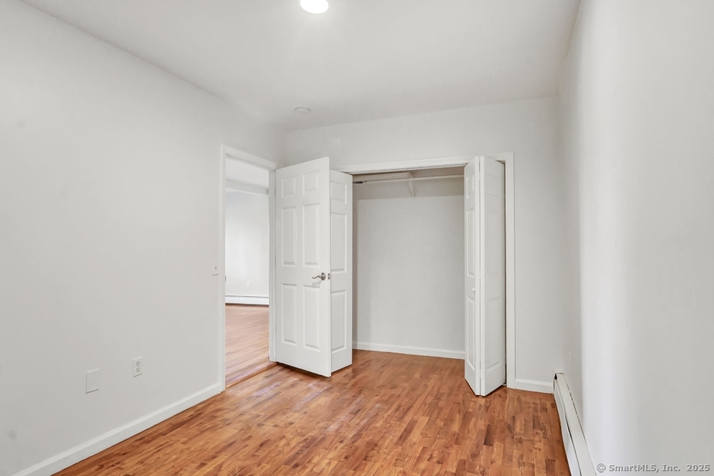 100 Mt Pleasant Street Derby, CT 06418 - Photo 19 of 40 a view of an empty room and wooden floor