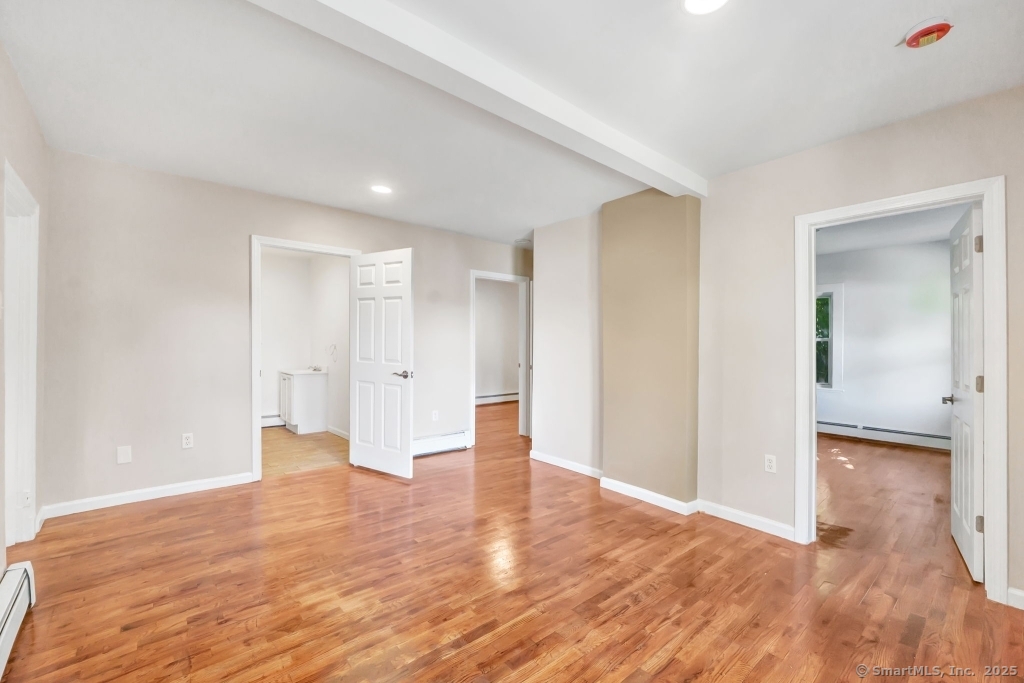 100 Mt Pleasant Street Derby, CT 06418 - Photo 2 of 40 a view of empty room with wooden floor