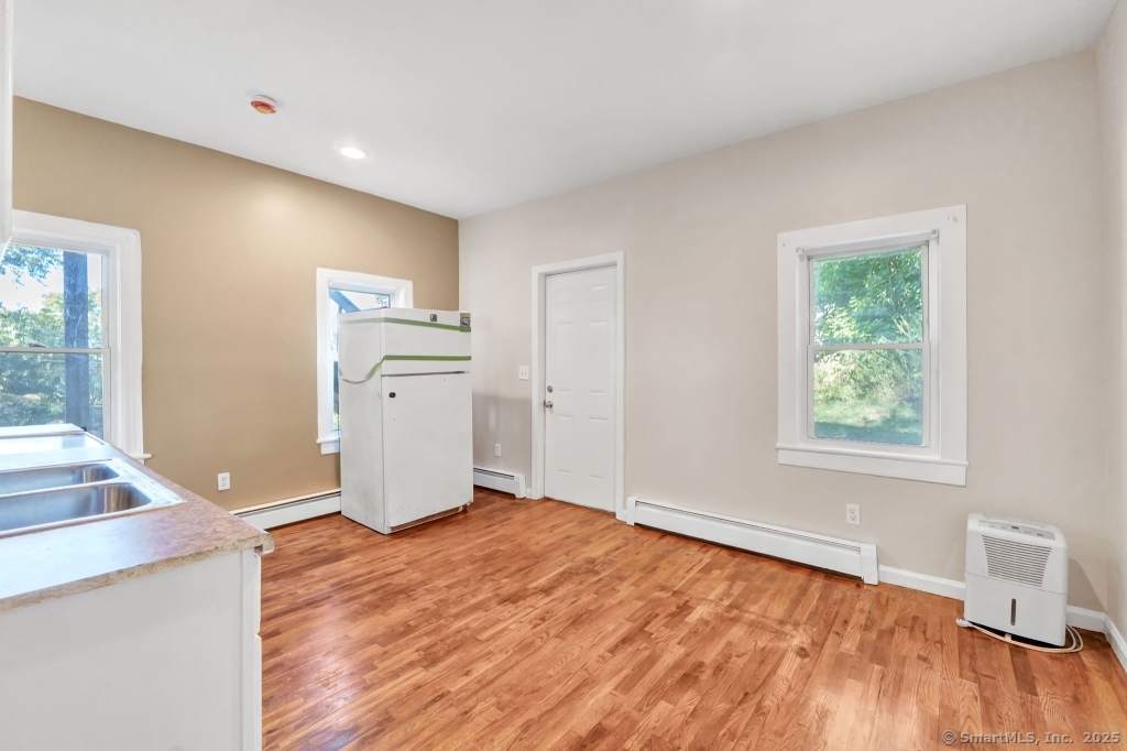 100 Mt Pleasant Street Derby, CT 06418 - Photo 22 of 40 a view of a livingroom with a computer on the desk and a window