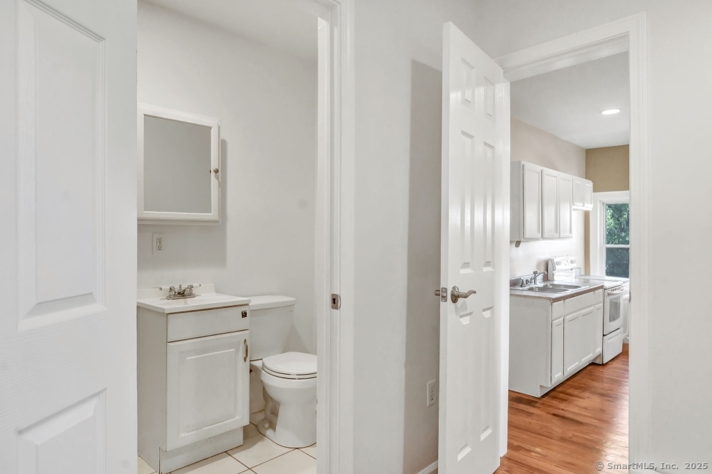 100 Mt Pleasant Street Derby, CT 06418 - Photo 34 of 40 a bathroom with a toilet sink and mirror