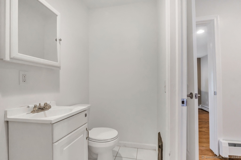 100 Mt Pleasant Street Derby, CT 06418 - Photo 38 of 40 a bathroom with a sink toilet and vanity