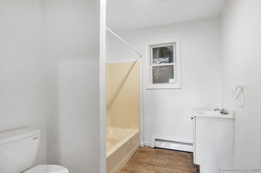 100 Mt Pleasant Street Derby, CT 06418 - Photo 39 of 40 a bathroom with a granite countertop window and a white door