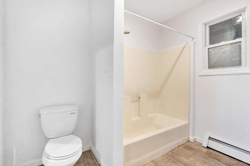 100 Mt Pleasant Street Derby, CT 06418 - Photo 40 of 40 a bathroom with a toilet and a bathtub