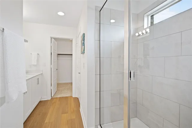 a bathroom with a bathtub and a shower