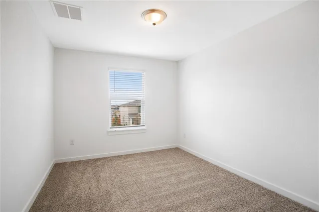 a view of a room that has a window in it