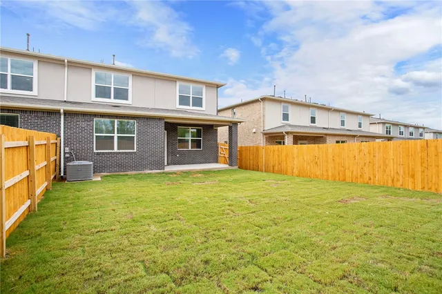 a view of a brick house with a large window