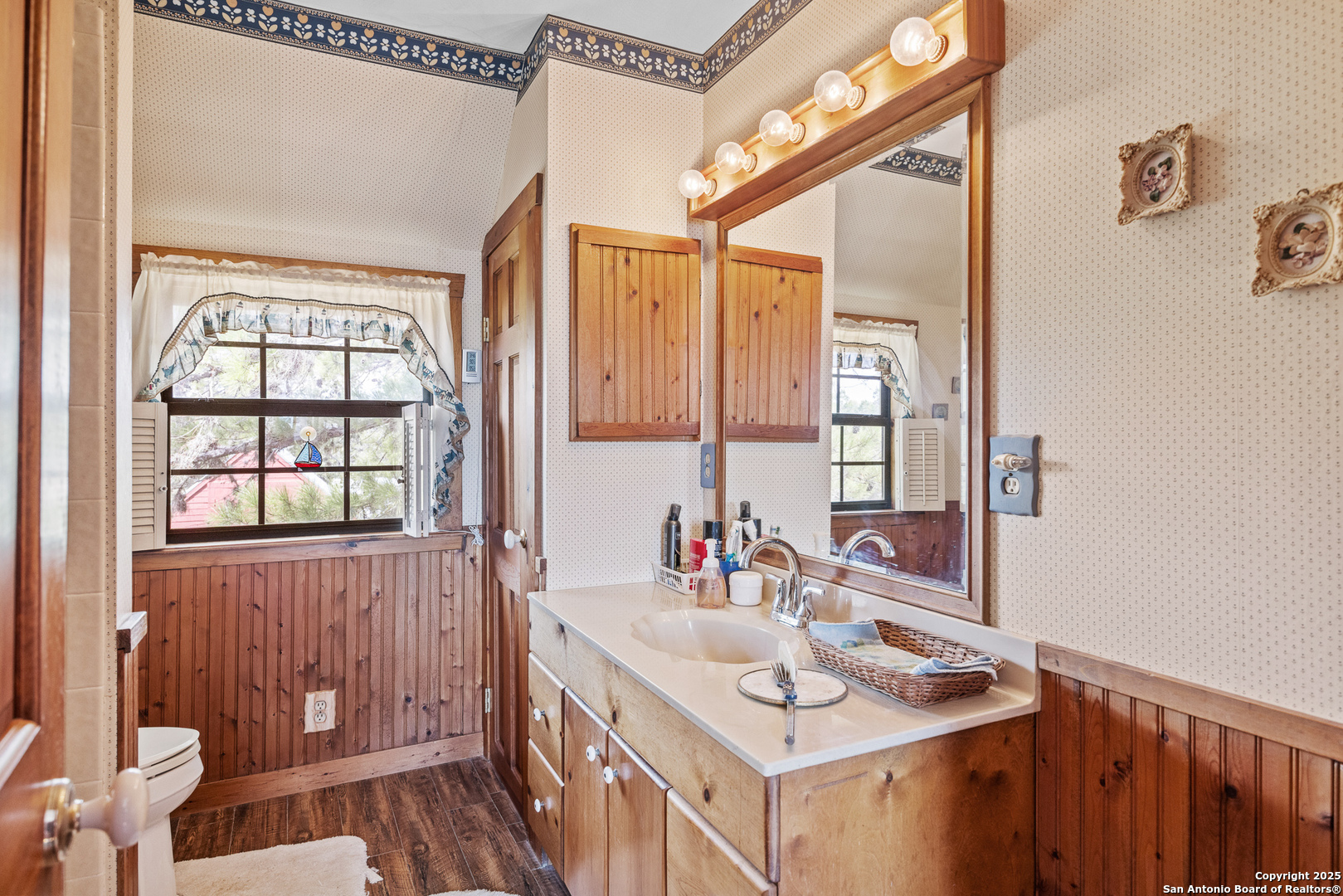667 Medina Bend Road Medina, TX 78055 - Photo 13 of 40 a bathroom with a sink and a mirror