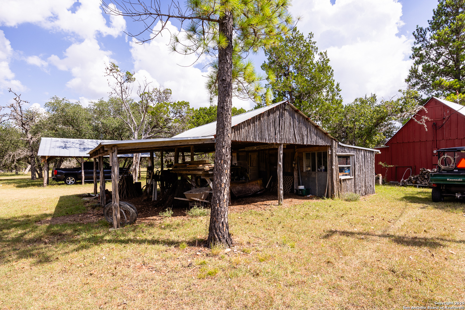 667 Medina Bend Road Medina, TX 78055 - Photo 15 of 40 a view of a house with a yard covered in snow