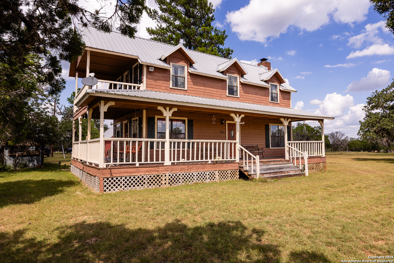 667 Medina Bend Road Medina, TX 78055 - Photo 2 of 40 a front view of a house with a yard