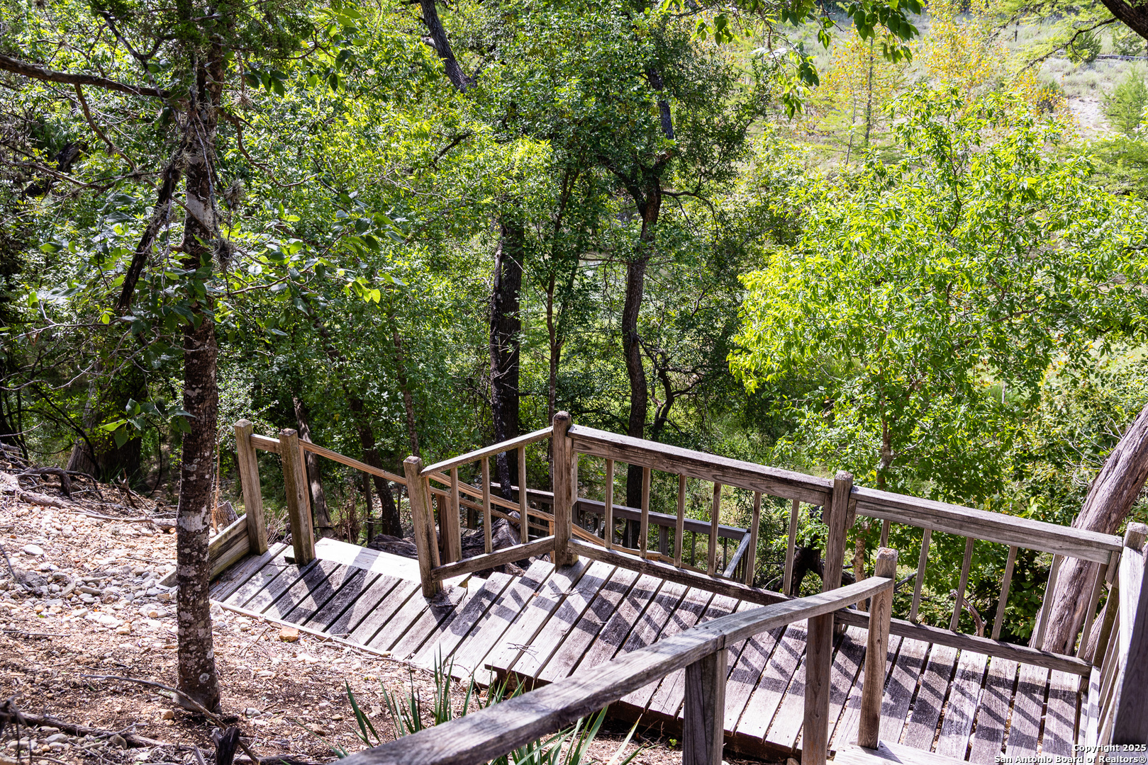 667 Medina Bend Road Medina, TX 78055 - Photo 23 of 40 a view of a balcony with wooden floor
