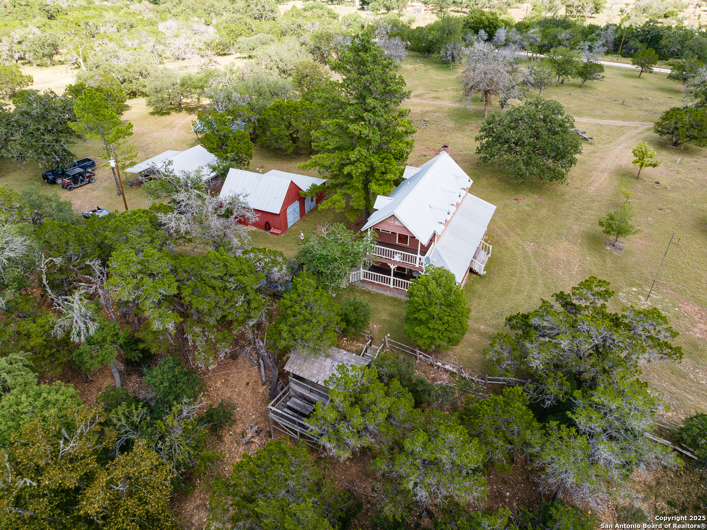 667 Medina Bend Road Medina, TX 78055 - Photo 39 of 40 an aerial view of a house with a lake view