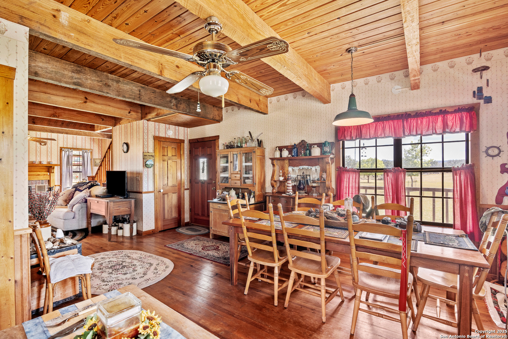 667 Medina Bend Road Medina, TX 78055 - Photo 7 of 40 a dining room with wooden floor and furniture