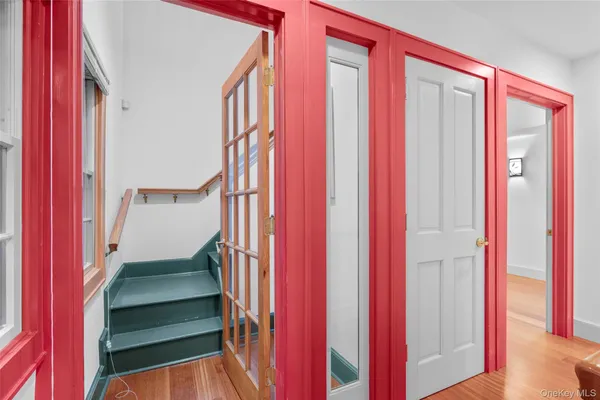 a view of a hallway with stairs