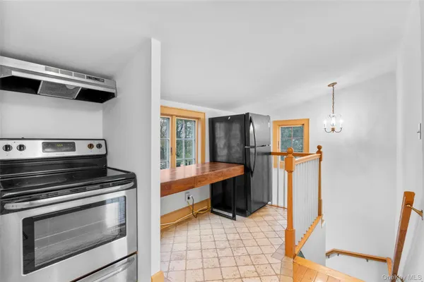 a kitchen with a stove and a refrigerator