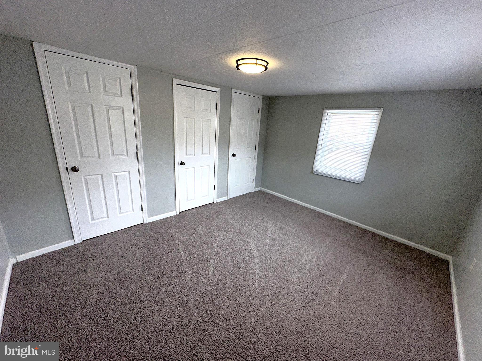 2400 Lincoln Avenue, Unit 15 Sparrows Point, MD 21219 - Photo 12 of 24 a view of an empty room and window