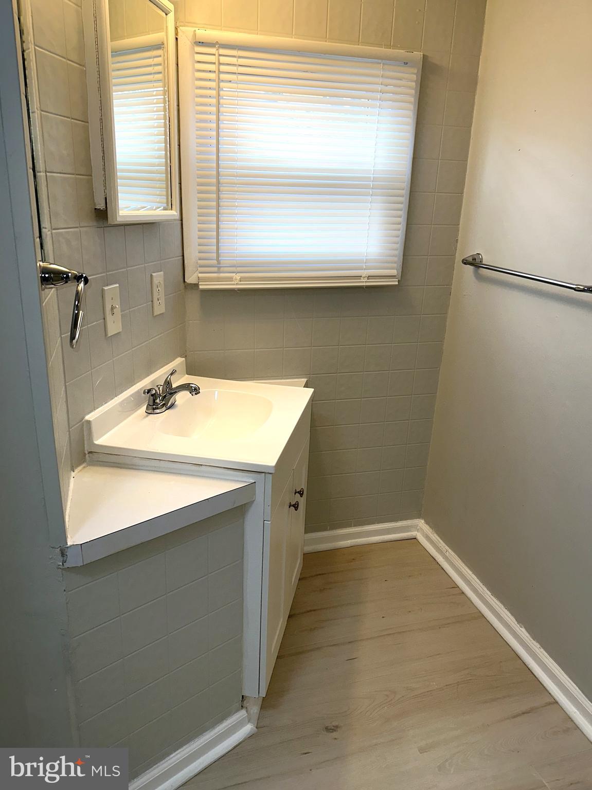 2400 Lincoln Avenue, Unit 15 Sparrows Point, MD 21219 - Photo 16 of 24 a bathroom with a sink and a mirror