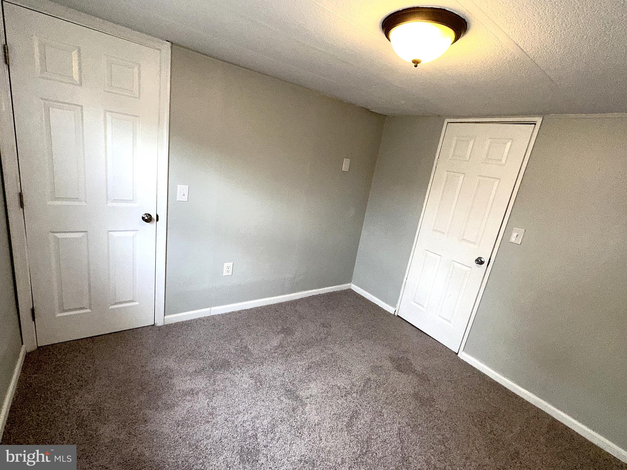 2400 Lincoln Avenue, Unit 15 Sparrows Point, MD 21219 - Photo 18 of 24 an empty room with windows