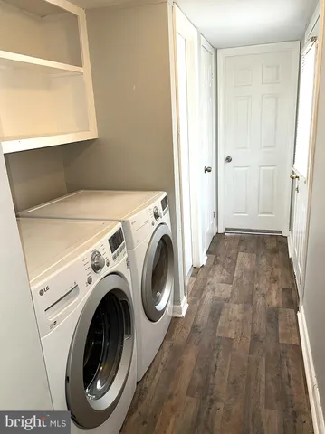 a view of a house with wooden fence