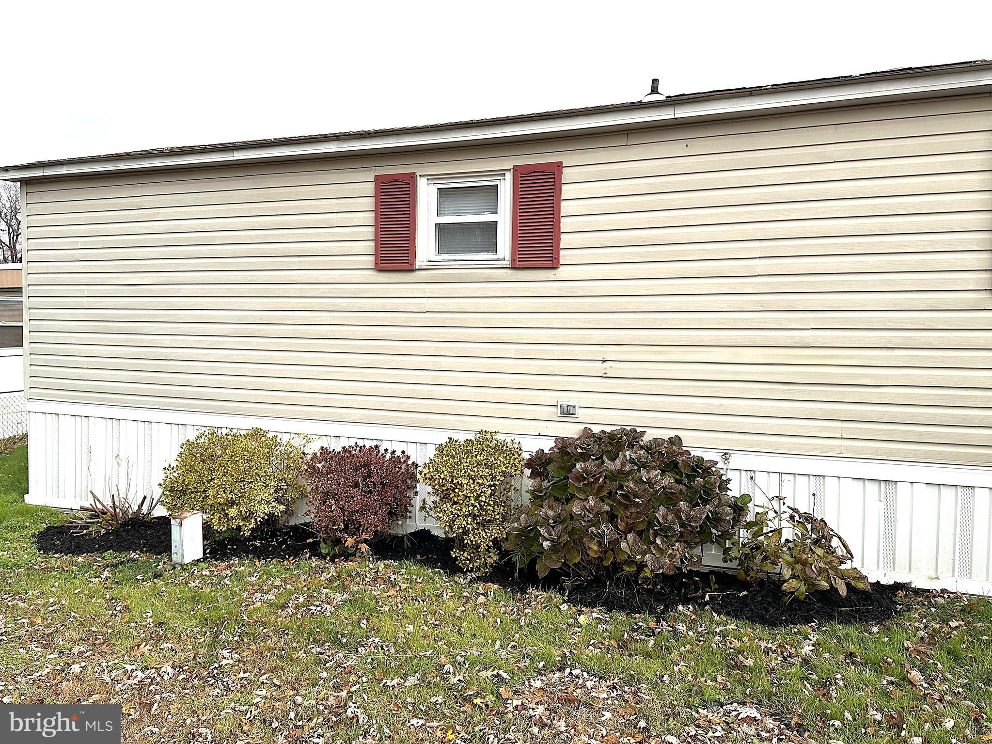 2400 Lincoln Avenue, Unit 15 Sparrows Point, MD 21219 - Photo 21 of 24 a front view of a house with a yard