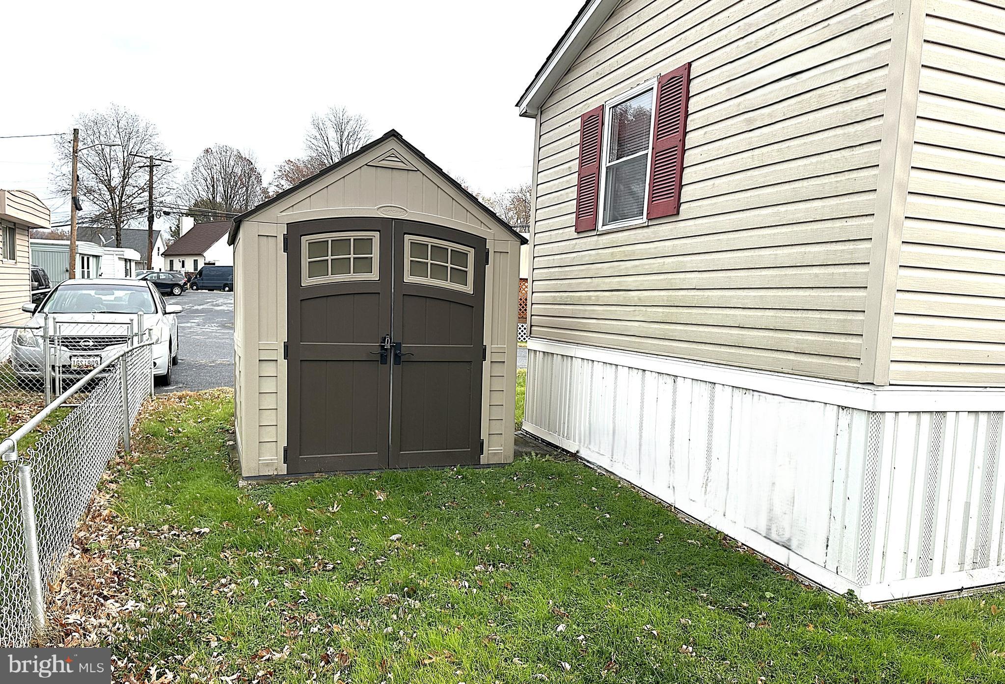 2400 Lincoln Avenue, Unit 15 Sparrows Point, MD 21219 - Photo 22 of 24 a front view of a house with a yard