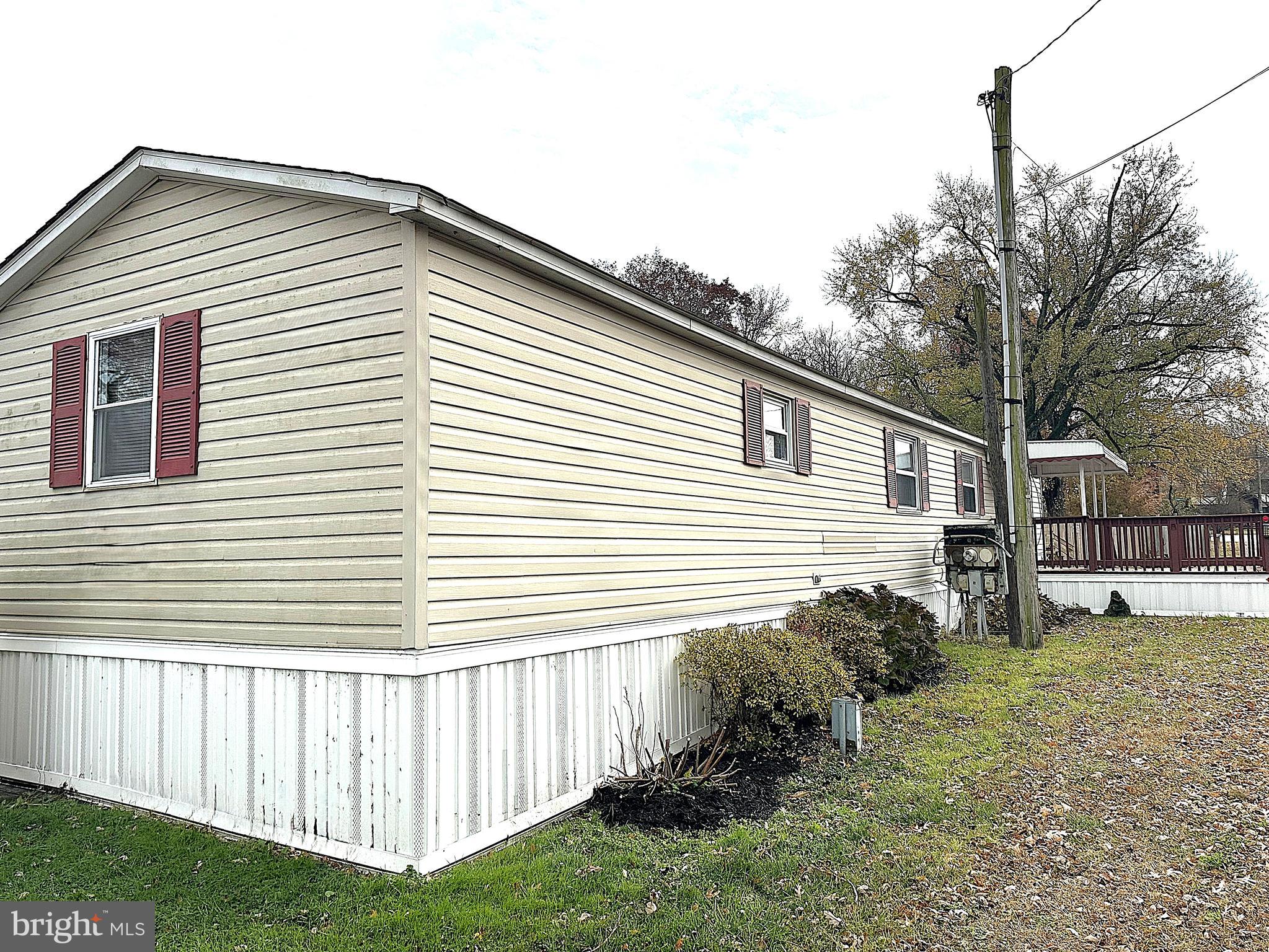 2400 Lincoln Avenue, Unit 15 Sparrows Point, MD 21219 - Photo 23 of 24 a front view of a house with a yard