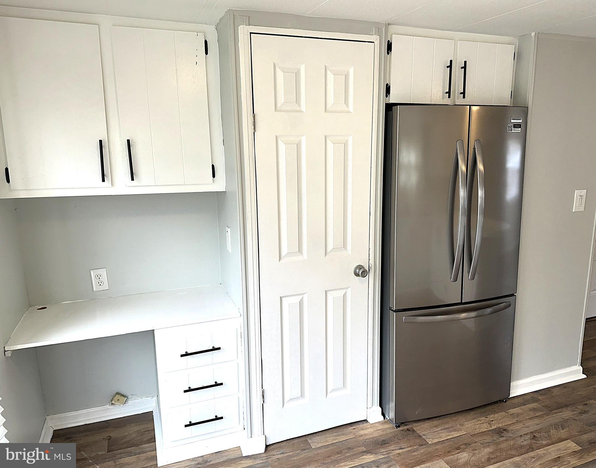 2400 Lincoln Avenue, Unit 15 Sparrows Point, MD 21219 - Photo 3 of 24 a kitchen with stainless steel appliances a refrigerator and cabinets