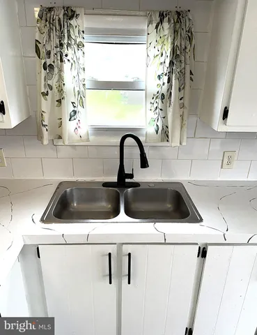 a view of a kitchen in the house