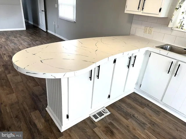 a kitchen with a sink and a stove