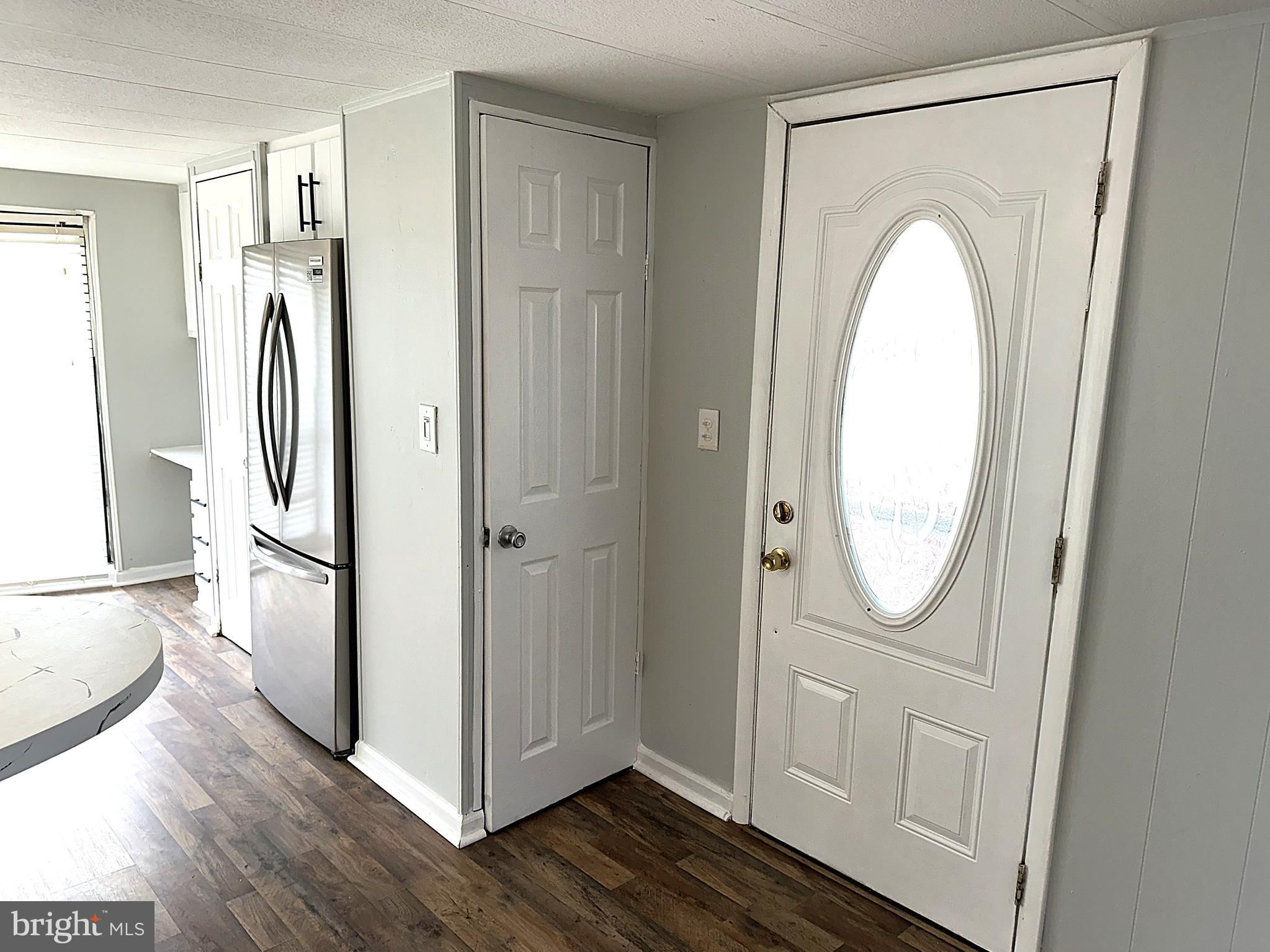 2400 Lincoln Avenue, Unit 15 Sparrows Point, MD 21219 - Photo 10 of 24 a view of a bathroom with wooden floor and mirror