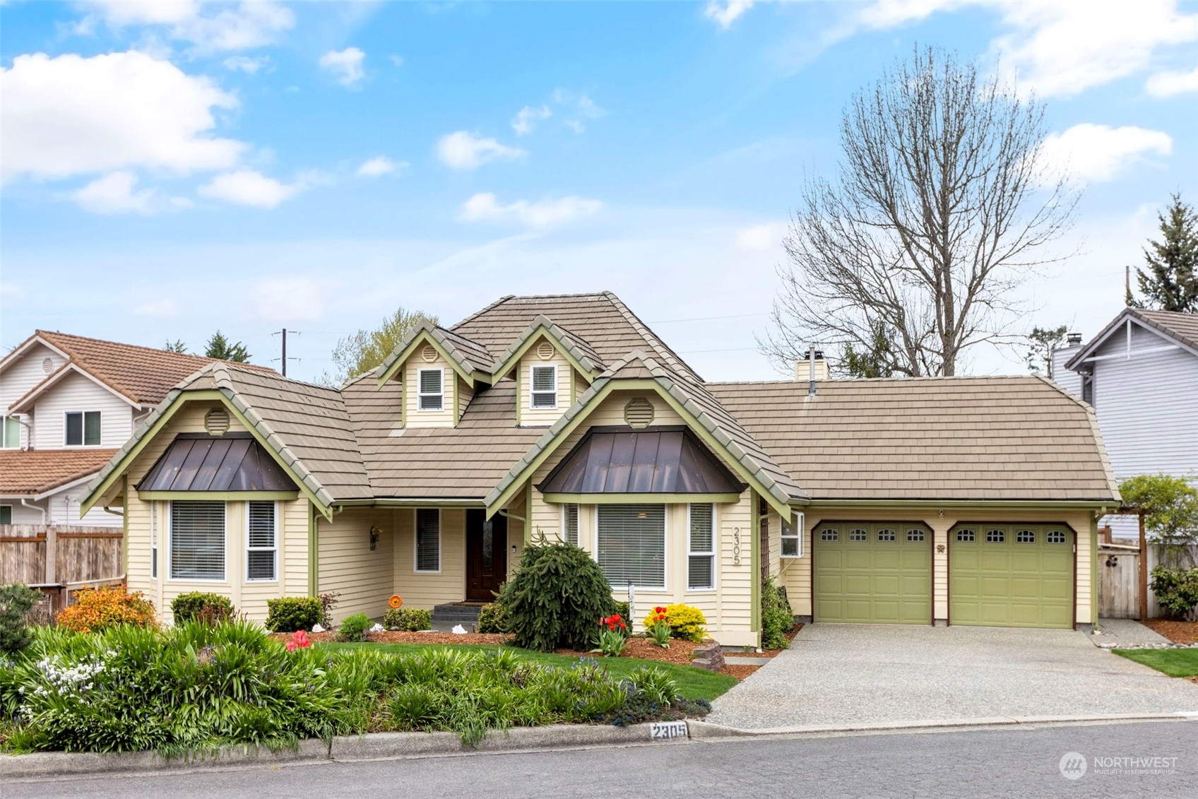 2305 Main Court South Renton, WA 98055 - Photo 1 of 39 a front view of a house with a garden