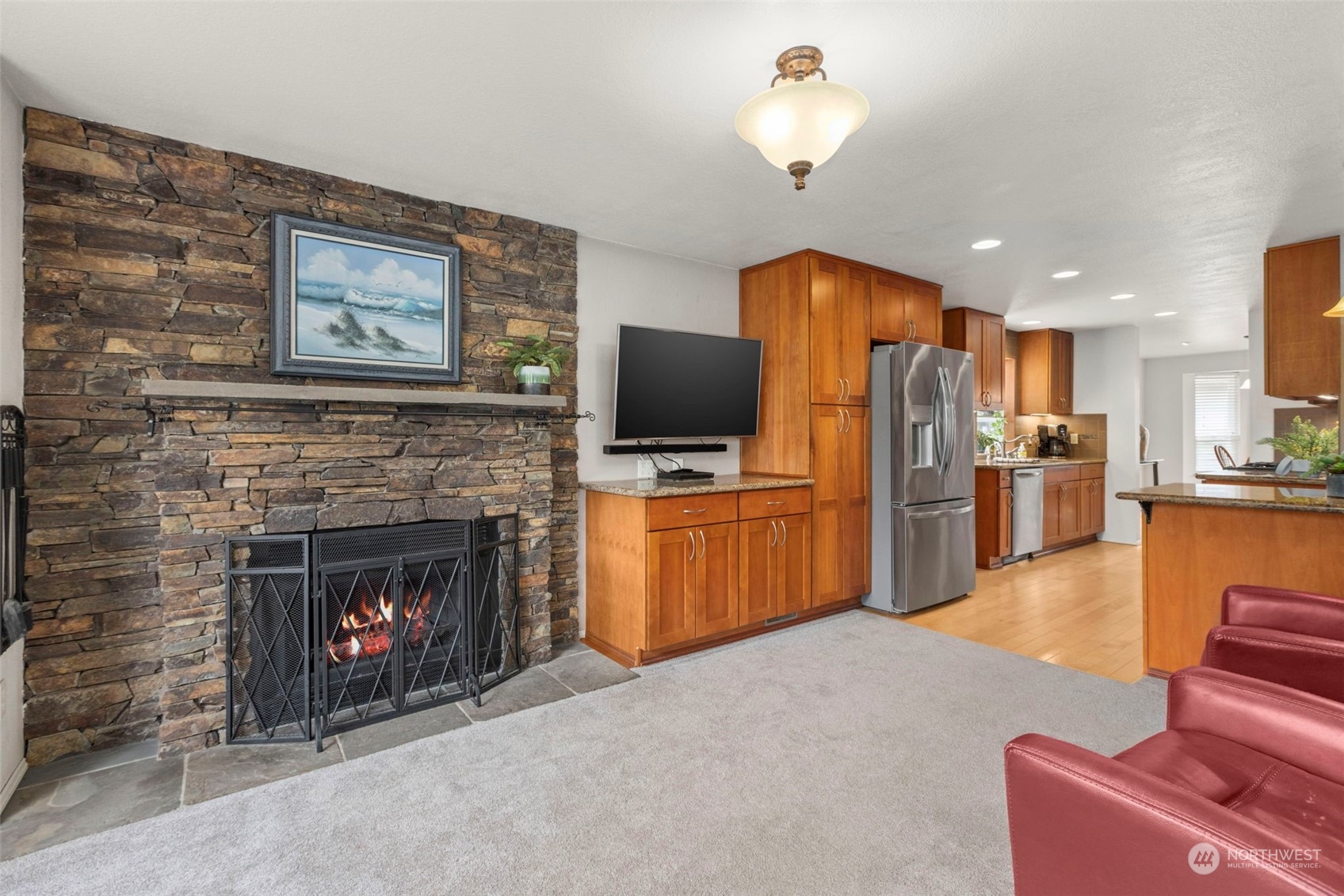 2305 Main Court South Renton, WA 98055 - Photo 6 of 39 a living room with furniture a fireplace and kitchen view