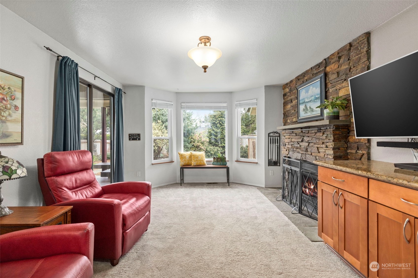 2305 Main Court South Renton, WA 98055 - Photo 7 of 39 a living room with furniture a flat screen tv and windows
